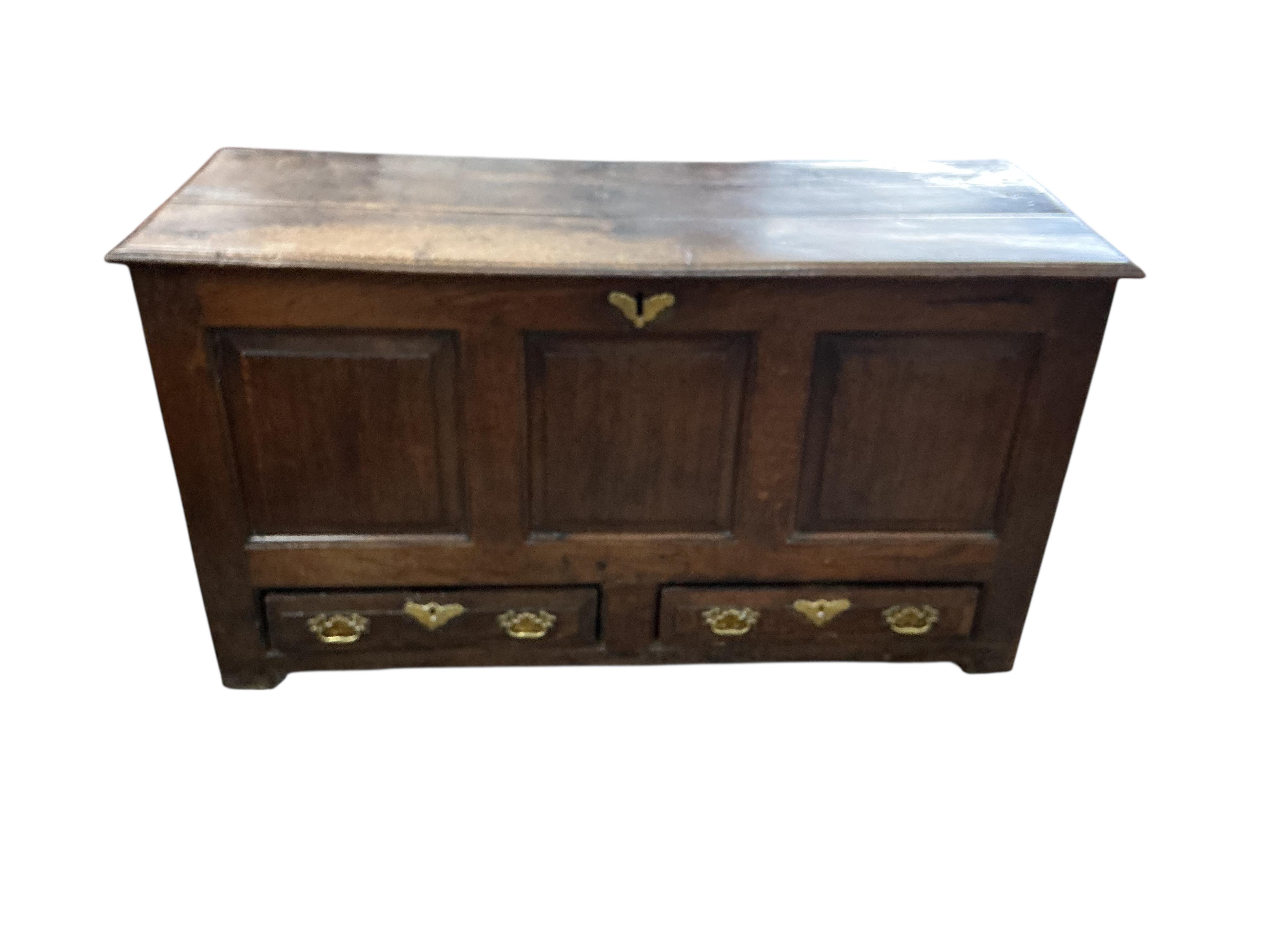 An early 18th century panelled oak mule chest, width 126cm, depth 48cm, height 68cm